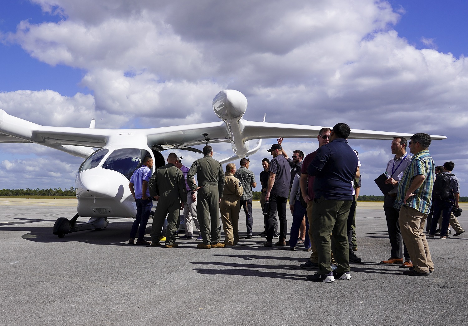 AFWERX Airmen and several local media outlets gathered at Duke Field on Eglin Air Force Base, Florida, to witness the delivery of BETA's ALIA electric aircraft to the Air Force for testing Oct. 26, 2023.  AFWERX first partnered with BETA, an electric aerospace company, in December 2019 and has since awarded them several contracts. Located 10 miles north of Eglin Air Force Base, Duke Field was strategically selected as the test field for ALIA. The field is home to the Air Force’s rotary wing test squadron, the 413th Flight Test Squadron.  (U.S. Air Force photo by Jennifer Bryant)