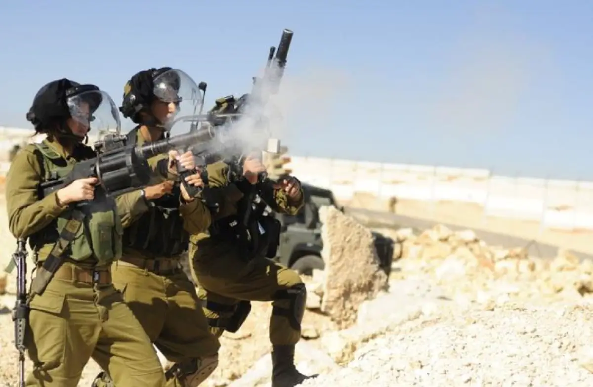 IDF soldier fires an automatic grenade launcher during training