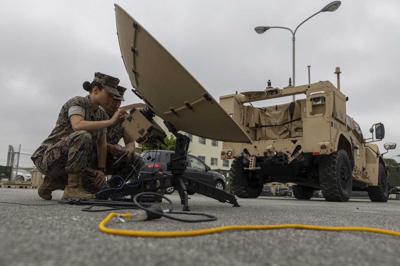 Marines with the 31st Marine Expeditionary Unit, establish an Internet connection using a Tampa Microwave satellite dish during a communications exercise at Camp Hansen, Okinawa, Japan, April 19, 2023.