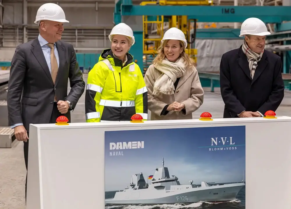 The steel cutting marks the start of the construction phase for the F126 project. From left: Damen Naval Managing Director Roland Briene, Minister-President of the German state of Mecklenburg-Vorpommern, Manuela Schwesig, Parliamentary State Secretary at the Federal Ministry of Defence of Germany,and Lürssen CEO Friedrich Lürssen