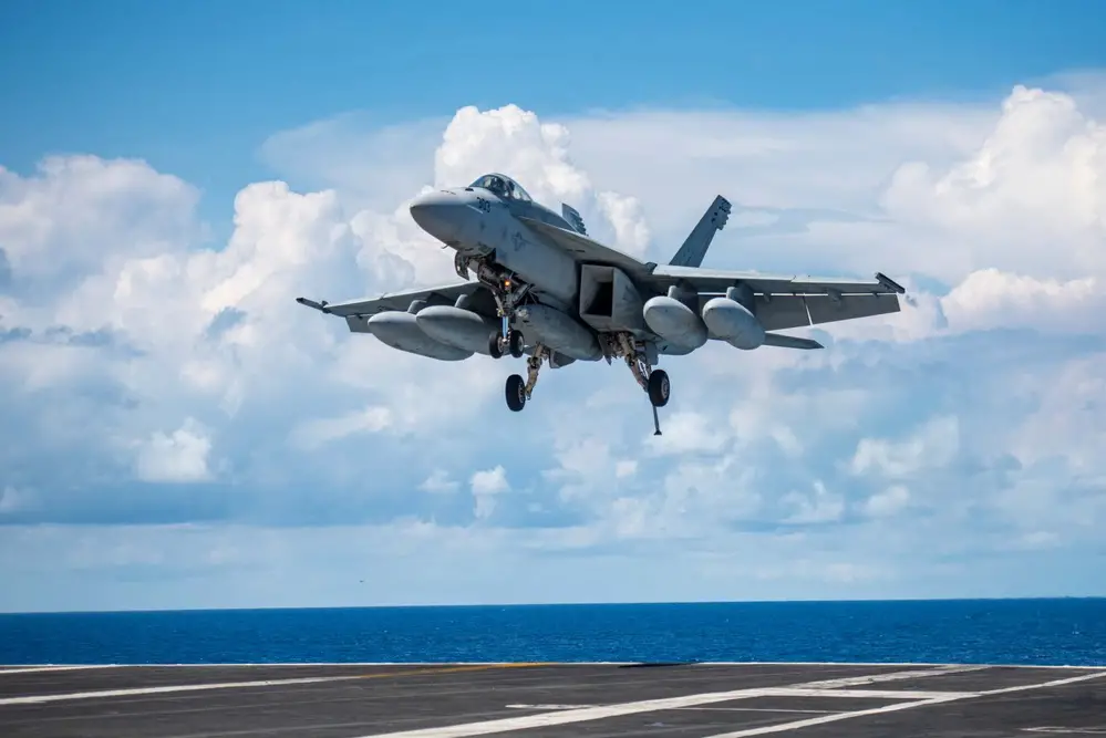  An F/A-18E Super Hornet, attached to the Eagles of Strike Fighter Squadron (VFA) 115, lands on the flight deck of the U.S. Navy’s only forward-deployed aircraft carrier, USS Ronald Reagan (CVN 76), in the South China Sea, Oct. 20.