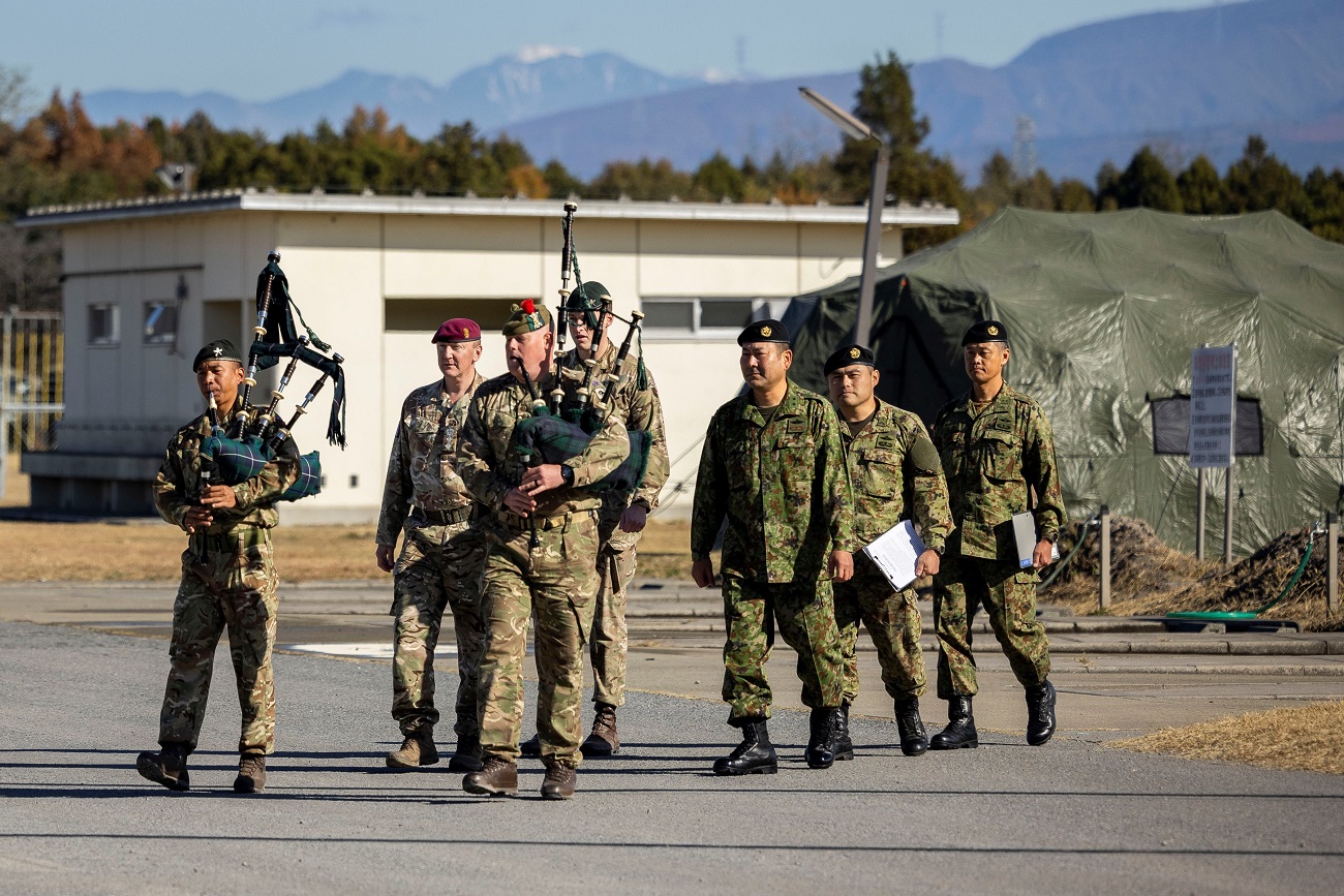 Corporal Fraser Hall, 3 SCOTS, on right, playing the bagpipes at the opening ceremony of Exercise Vigilant Isles on 15 November 2023.