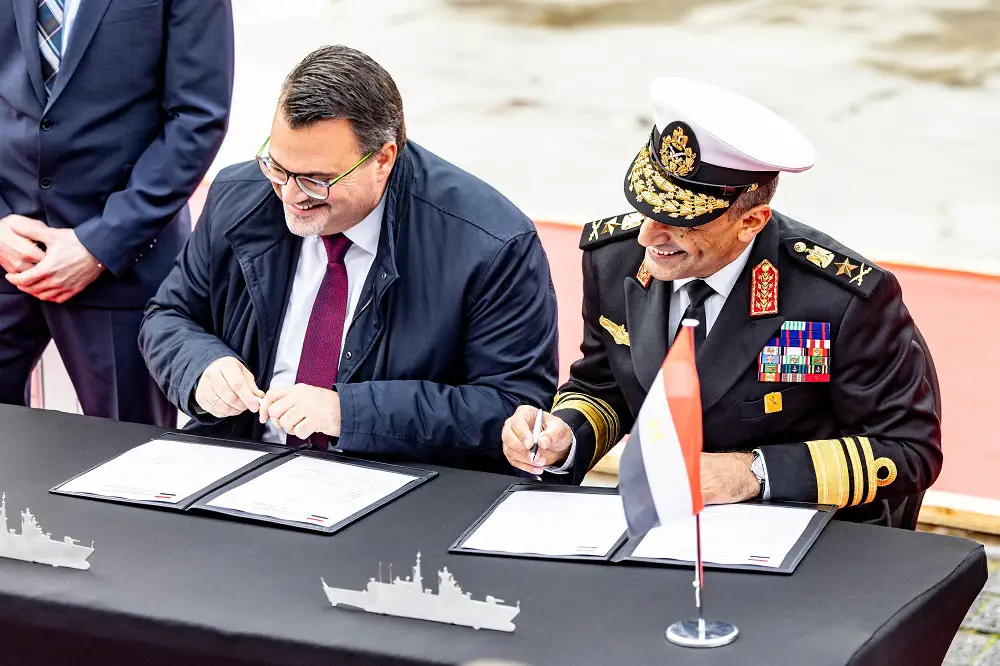 CEO Oliver Burkhard and Vice Admiral Atwa signing the delivery protocol