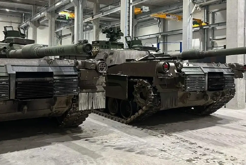 Lithuania enhances technical support for Abrams tanks at military maintenance facility.