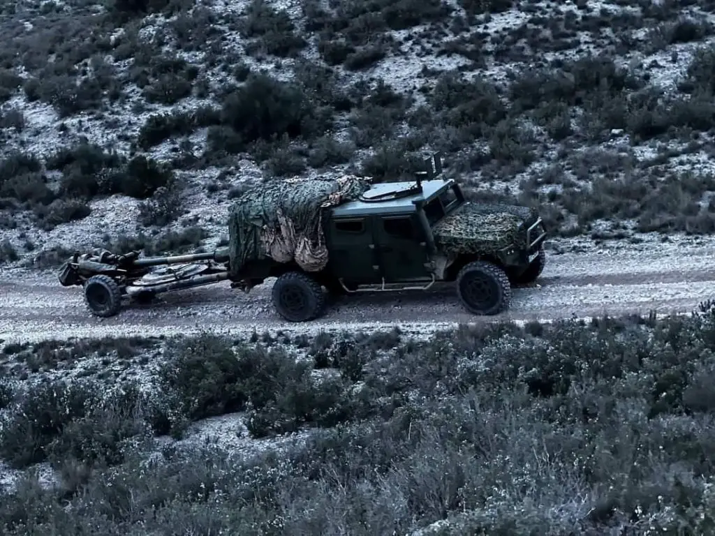 Spanish Army URO VAMTAC Light Artillery Tractor pulling L118 105 mm towed light howitzer.
