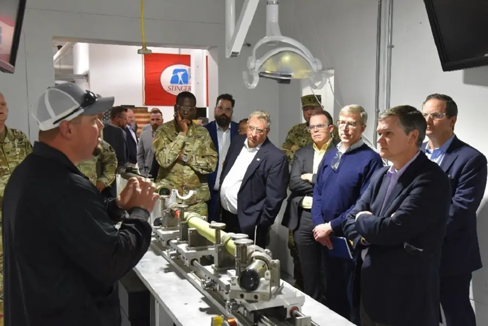 MCAAP Electronic Integrated System Mechanic Leader, Garett Rose, briefs the Honorable Douglas Bush (Army Acquisition Executive) during his visit to MCAAP's Stinger Missile Refurbishment Facility, May 2, 2023. (Photo by U.S. Army photo)