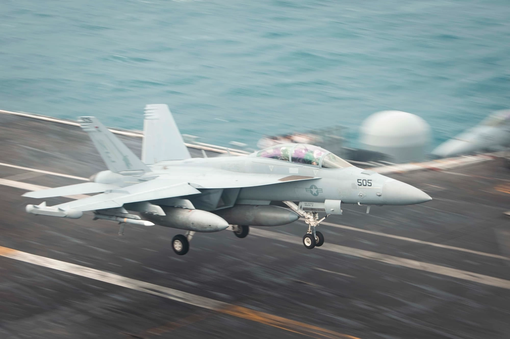 An EA-18G Growler, assigned to the “Gauntlets” of Electronic Attack Squadron (VAQ) 136, recovers on the flight deck of Nimitz-class aircraft carrier USS Carl Vinson (CVN 70). Vinson, flagship of Carrier Strike Group ONE, is deployed to the U.S. 7th Fleet area of operations in support of a free and open Indo-Pacific. (U.S. Navy photo by Mass Communication Specialist 3rd Class Joshua Sapien)