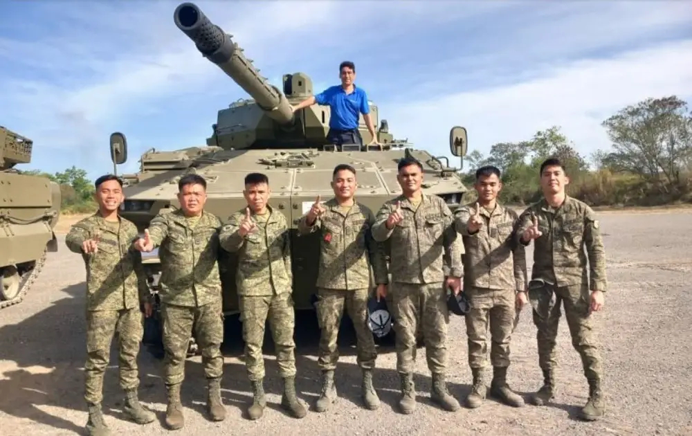 Engineers and the First Tank Battalion of the Philippine Army's First Armored Division after completing training in front of an ASCOD light tank