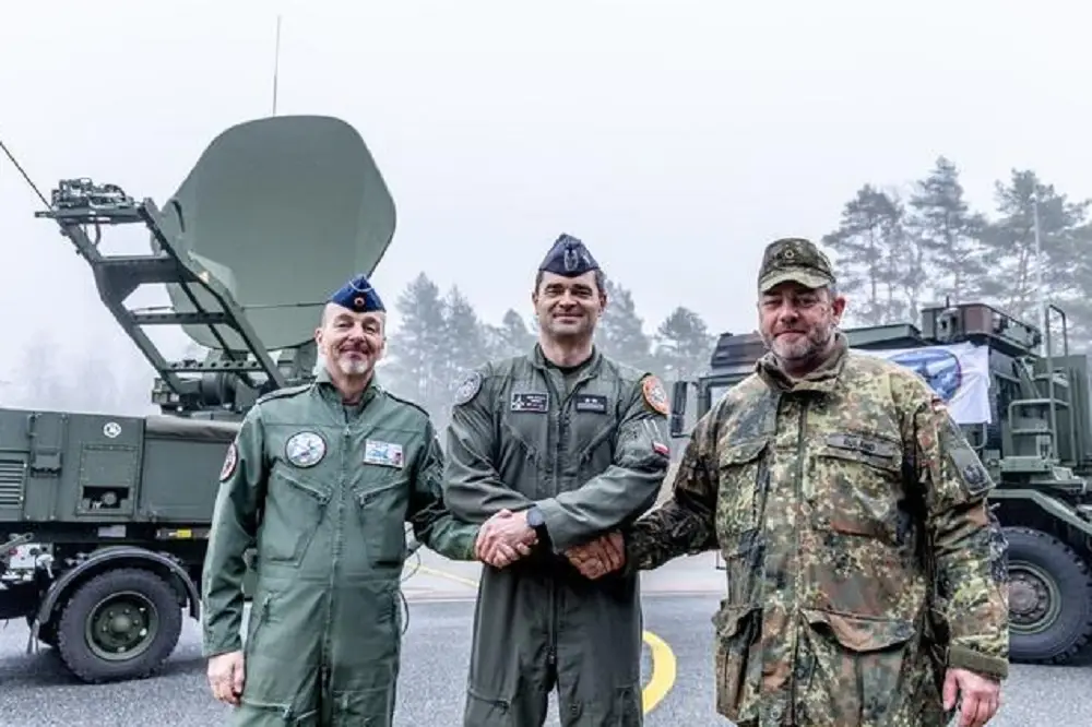 The Polish F-16 Detachment Commander (centre), shanking hands with the German commanders of the Eurofighter detachment (left)  and the Deployable Control and Reporting Centre (right).