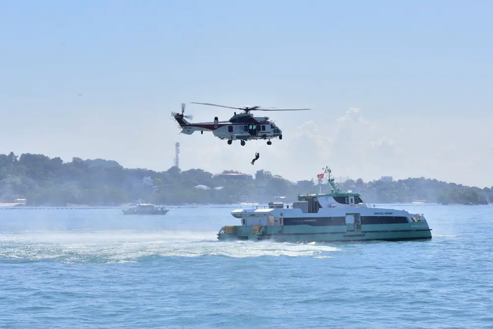 The RSAF's H225M Medium Lift Helicopter being deployed to winch a "critically injured" dummy passenger off the incident vessel during the multi-agency Ferry Rescue Exercise in 2023.