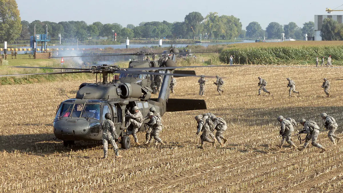 a group of soldiers running on a fieldAir Industries Group Receives Orders for Components Used on UH-60 Black Hawk and H-92 Helicopters