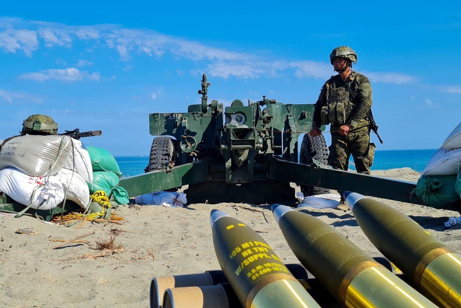The howitzer platoon of the Bravo Battery, 5th Field Artillery Battalion (5FAB) utilizing a towed gun prepares to hit their off-shore target during the Counter-Landing live fire drill at the Sand Dunes, La Paz, Laoag City, Ilocos Norte on May 6, 2024.? 