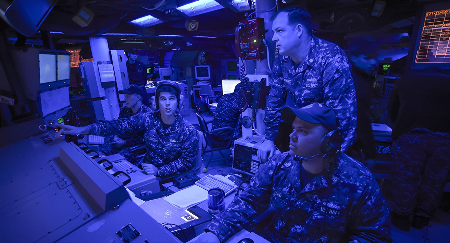 Fleet Synthetic Training exercises taking place aboard a ship.