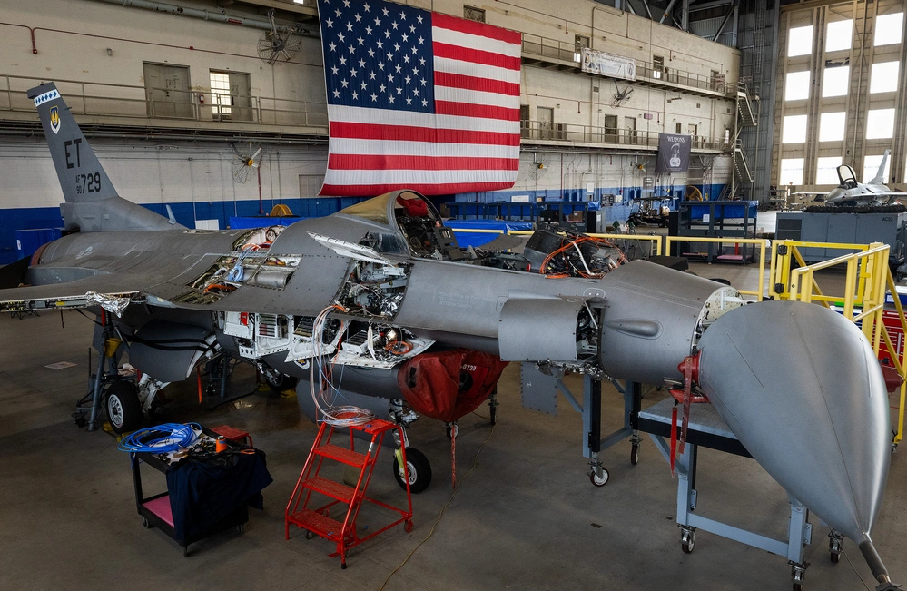 An F-16 Fighting Falcon undergoes modifications as part of the Viper Experimentation and Next-gen Operations Model – Autonomy Flying Testbed program at Eglin Air Force Base, Florida. The changes include software, hardware and instrumentation that will allow the aircraft to fly autonomously. (U.S. Air Force photo by Samuel King Jr.)