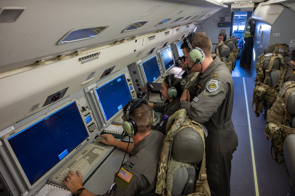 U.S.A.F Aircrew and Royal Australian Air Force aircrew sit at the on-board mission consoles inside an E-7A Wedgetail aircraft prior to a Weapons School Integration mission at Nellis Air Force Base in 2024. (U.S. Air Force photo by Airman 1st Class Brianna Vetrok)