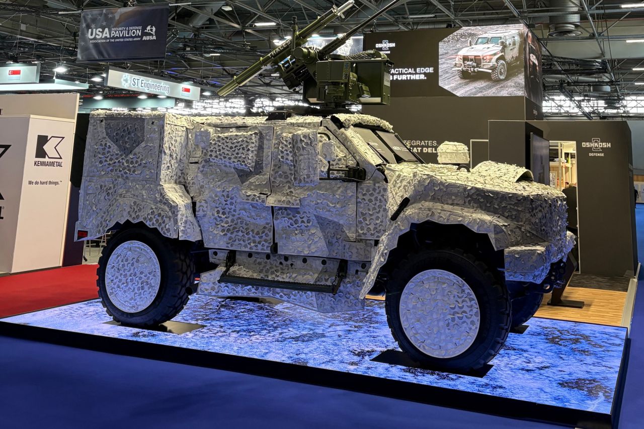 The hybrid electric JLTV (eJLTV), displayed in three Saab, Inc. camouflage covers: arctic.