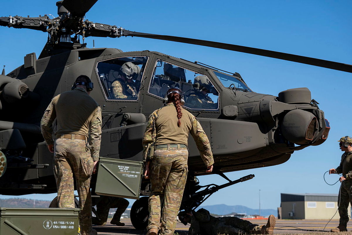 Australian Army soldiers from 1st Aviation Regiment conduct rearming and refuelling on an Australian AH-64E Apache at RAAF Base Townsville during Exercise Possum Guns.