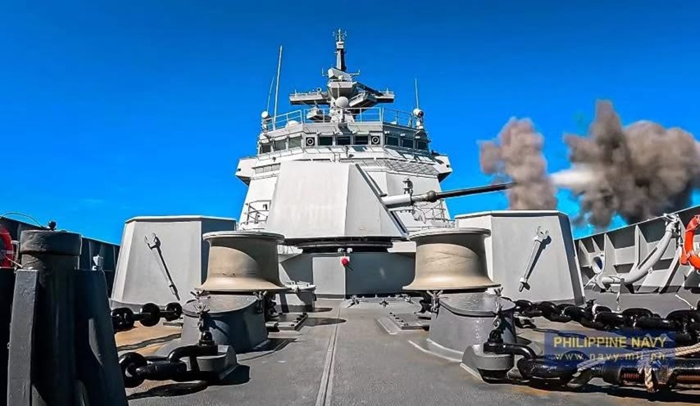 A dramatic, low-angle perspective taken from the forecastle of a Jose Rizal-class guided-missile frigate of the Philippine Navy.