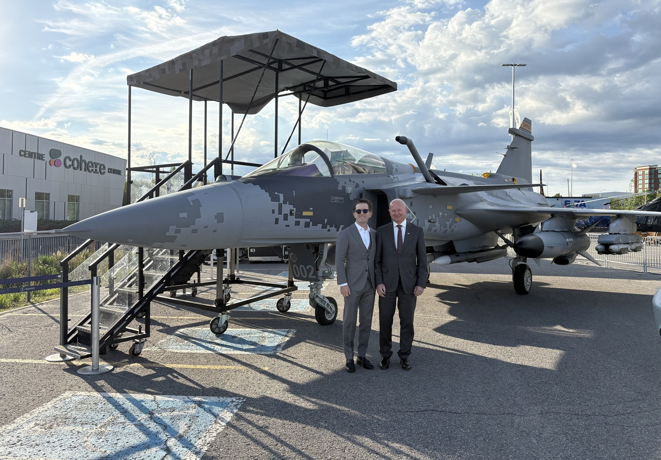 From left: Matthew Bromberg, CAE President and CEO, and Micael Johansson, Saab President and CEO in front of Saab's Gripen E fighter. (Photo by Saab)