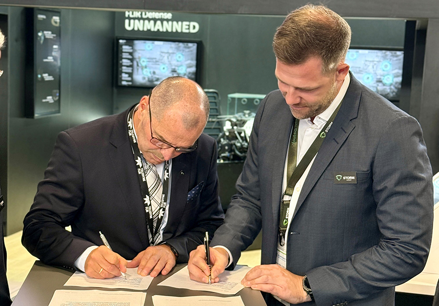 Harald Sørensen of Teledyne FLIR Defense and Andreas Rist of STORM Adapt Group sign partnership agreement at Eurosatory 2026.