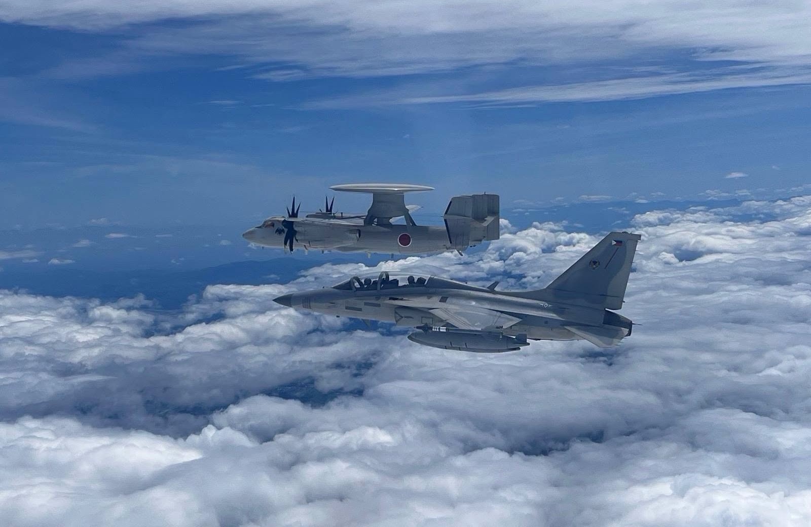 The Philippine Air Force (PAF) KAI FA-50PH Fighting Eagle light combat aircraft and the Japan Air Self-Defense Force (JASDF) Northrop Grumman E-2D Advanced Hawkeye airborne early warning and control (AEW&C). (Photo by PAF)