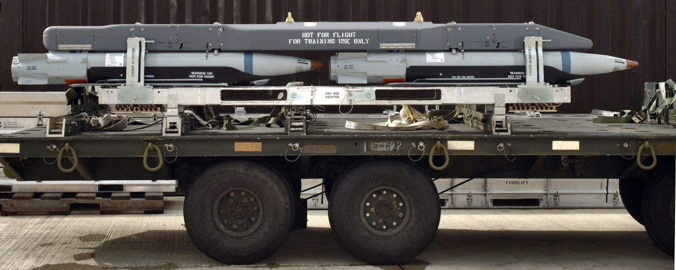 The Bomb Rack Unit 61 with carrier and four ground-training Guided Bomb Unit-39 small-diameter bombs on this munitions trailer undergoes testing at Royal Air Force Lakenheath, England. (U.S. Air Force photo/Master Sgt. Lance Cheung)