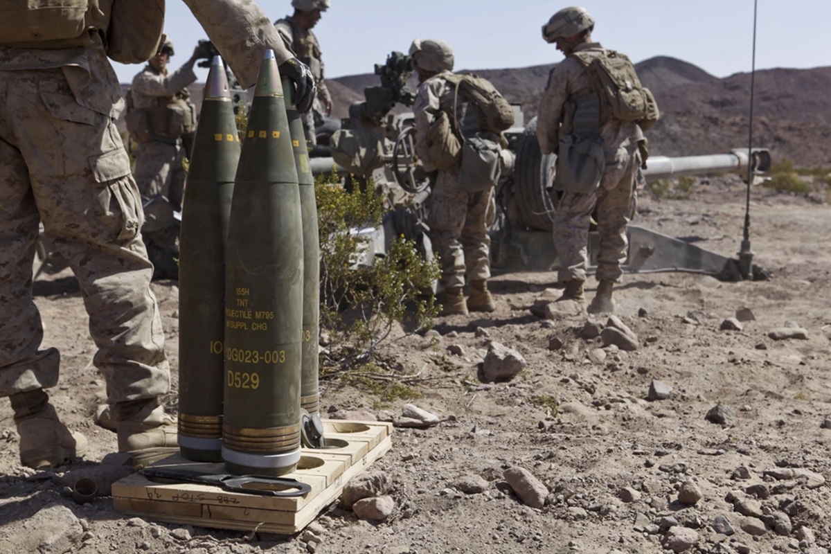 A U.S. Marine with Battery I, 3rd Battalion, 12th Marine Regiment stands ready to load an M795 High Explosive round into an M777 Lightweight 155mm Howitzer during the 11th Marine Regiment's Desert Fire Exercise aboard Marine Corps Air-Ground Combat Center 29 Palms, California. (U.S. Marine Corps photo by Lance Cpl. Sean Searfus, 1st Marine Division/ Released)